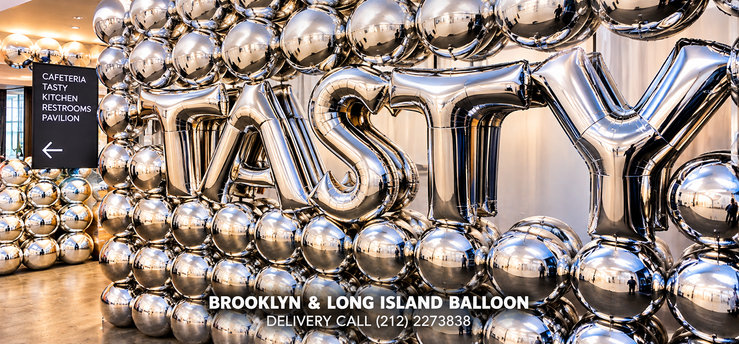 Silver metallic balloon installation spelling TASTY for a New York City event